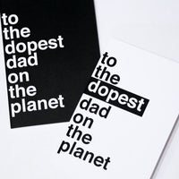 pictured are two greeting cards reading "to the dopest dad on the planet". one card is all black with white writing and the other card is white with black writing, where "dopest" is white and outlined with a black rectangle.
